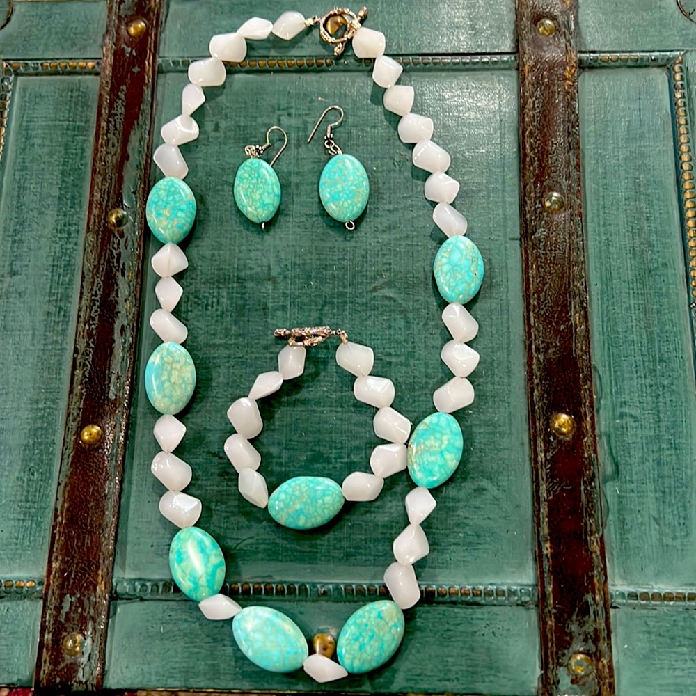 Necklace, bracelet, and earring matching set.